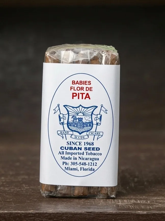 Babies Flor de Pita bundle of 25, cellophane-wrapped with the paper label reading Cuban Seed, all imported tobacco, made in Nicaragua