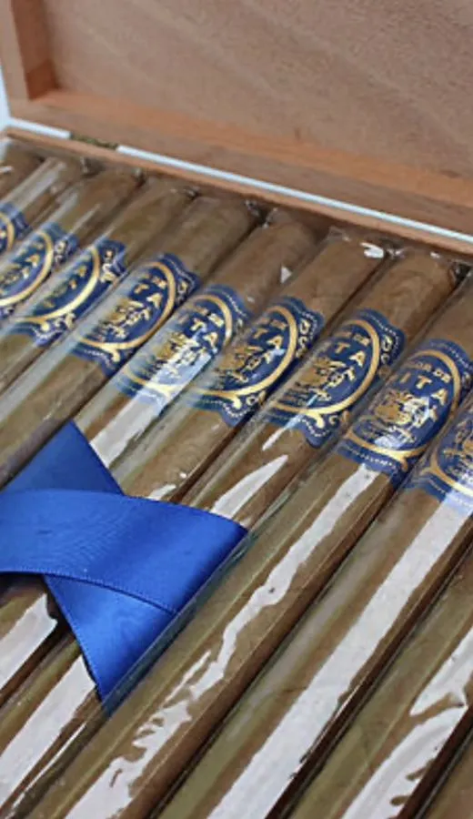 A box of Flor de Pita Selects cigars tied with blue ribbon