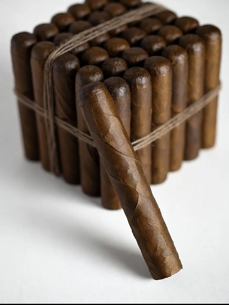Robusto Indonesian bundle with a single cigar resting against it